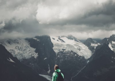 male traveller and summer mountain stormy landscape